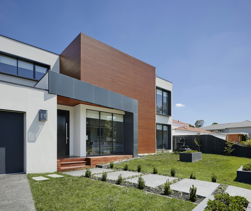 Contemporary residence with a courtyard and glass facade